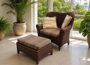 Delivery Available! Wicker Rattan Tommy Bahama Style Arm Chair and Ottoman! Great condition. Perfect for a Lanai! Arm chair 43x30x38in Seat Height 18i