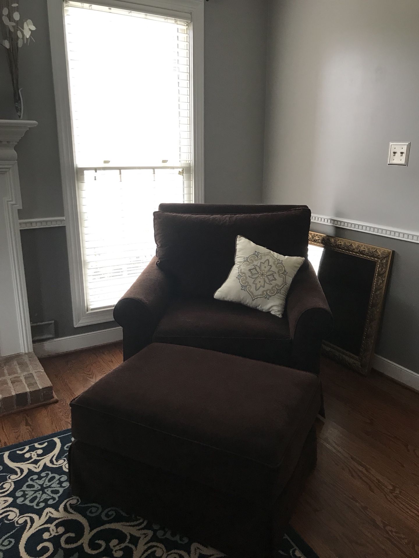 Large brown chair with ottoman