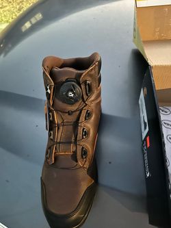 Brand new work boots with zip tie