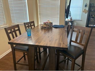 Beautiful wooden dining table with set of 4 chairs