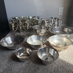 Silver bowls, candelabras, pitchers, and glass bowls