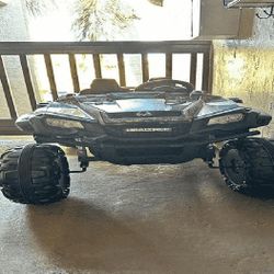 Kids' Electric Ride-On - Joy and Adventure for Small Drivers inside bed