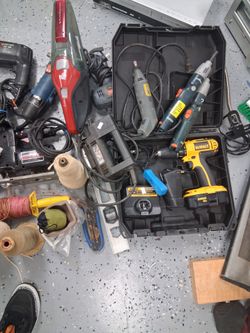 Tools, paint rollers,  caulking guns, light fixtures, giant zip ties, tile spacers, 12in support brackets, light fixtures,  hardware for drawers or cu