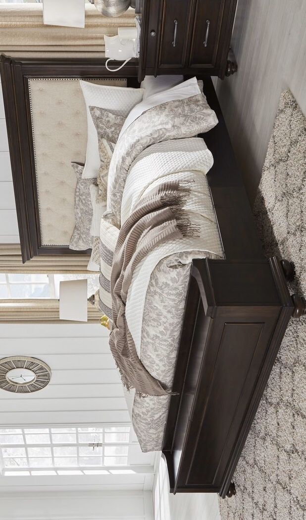 Brynhurst Dark Brown Queen Upholstered Storage Bed