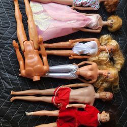 MCCLVIII, 1950s and 1960s barbies and little chap dolls $275 for the entire lot.
