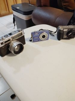 3 antique cameras