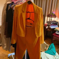 Express bright orange cropped blazer and matching trousers suit.  