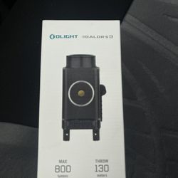Olight Baldr S BL, a compact rail-mounted tactical light with a blu