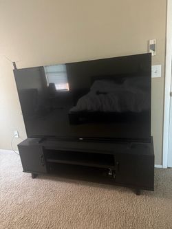Philips 65 inch TV and Black TV Stand