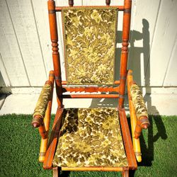 Antique sling back rocking chair