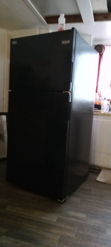  Black Maytag Refrigerator Full Size With Bright Illuminating Light In The Freezer