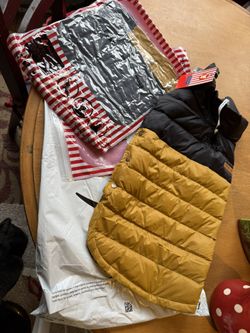 2 new dog coats. Bought on Amazon too small for my dogs. 16” from collar to butt. Only $10 for both. Rochester wa. 