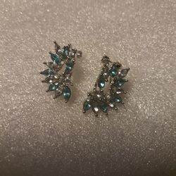 Ladies Unique Design Earrings,  Blue Topaz and Cz diamonds. 