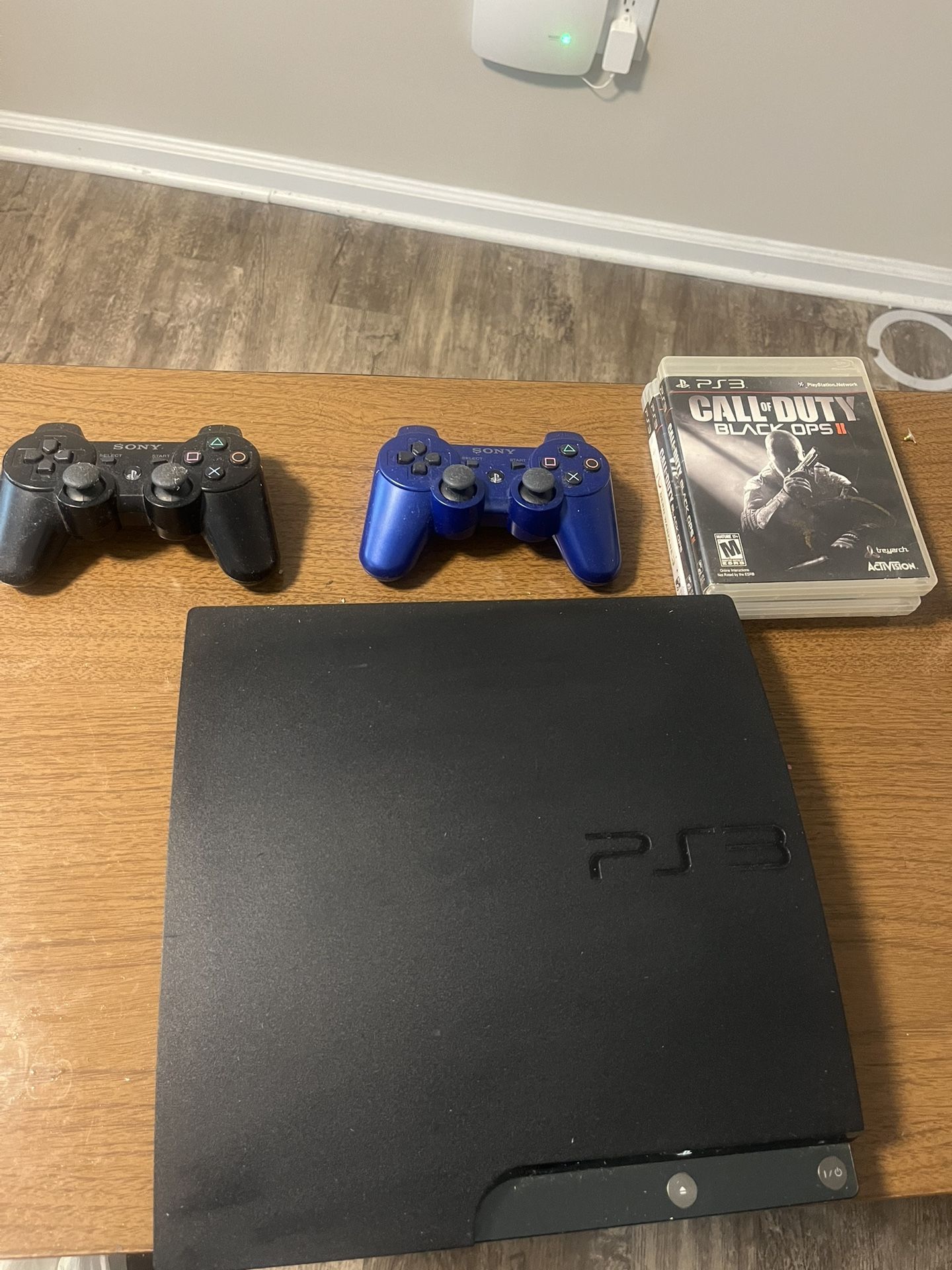 PS3 Slim (250 GB)  w/ Games