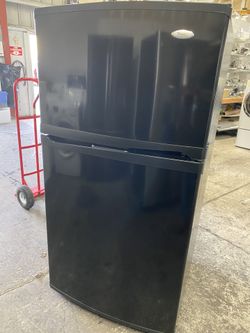 Vivid Black whirlpool gold refrigerator with ice maker can deliver