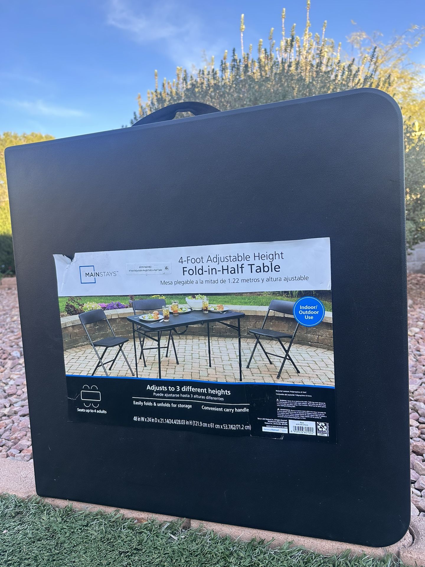 Mainstays 4-Foot Adjustable Height Fold-in-Half Table- brand new, never used.