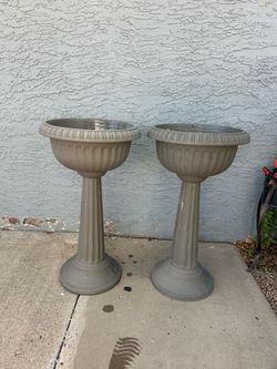 2 Pedestal planters , plastic Urn $25 both “27ave and Glendale “