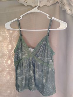 A Sexy Woman's Green Tank Top w/ Designs