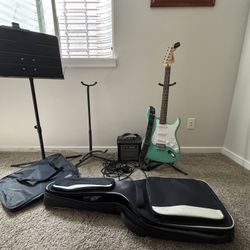 Electric Guitar With Amplifier, Cables, Traveling Case, Tuner And  Stands