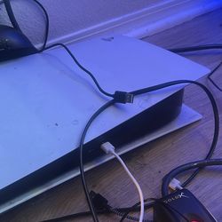 PlayStation 5 with two controllers