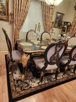 Ornate Black & Gold Dining table, chairs and buffet