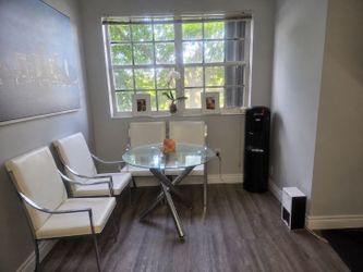 Round Glass Top Dining Table with Chrome Base