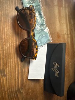 Maui Jim sunglasses with a tortoiseshell frame and brown lenses.