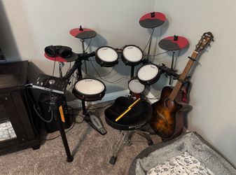 Electric drum comes with amp, chair, headphones, drum sticks, i spent 1,140  on this kit