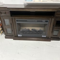 “I’m selling an electric fireplace, a coffee table, a side table, and a wine rack.”