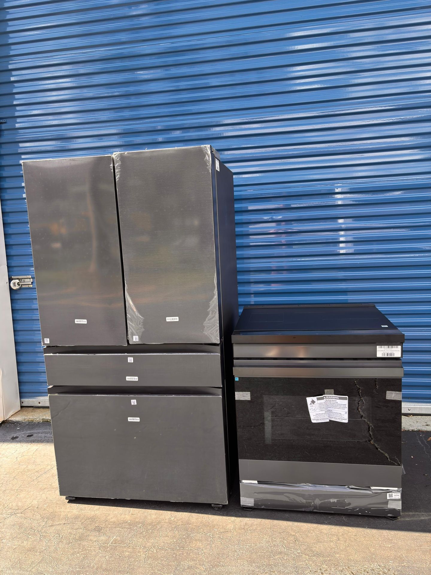 New Samsung Electric bespoke induction stove and new black stainless steel 4-door bespoke refrigerator