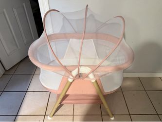 Pink bassinet with net (willing to negotiate)