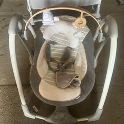 Ingenuity Dream & Grow Bedside Bassinet and an Ingenuity Boutique Collection Deluxe Swing 'n Go Portable Baby Swing in the Bella Teddy design