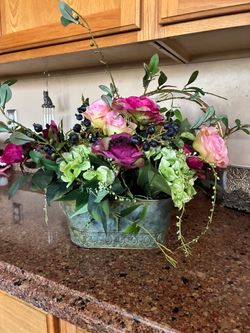 floral arrangement 14”h x 19” w