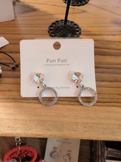 Round silver earrings dangling