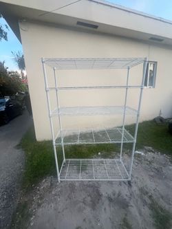 Freestanding white steel wire shelving unit