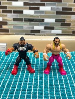 Mattel WWE Knuckle Crunchers action figures of Roman Reigns & Seth "Freakin