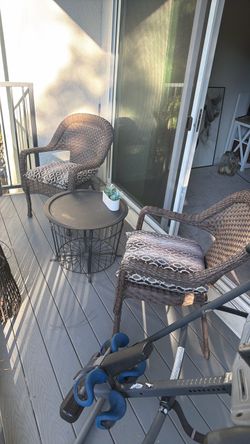 Two chairs and metal table