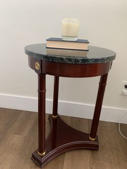 A Bombay Co. French Empire Neoclassical mahogany and marble side table.