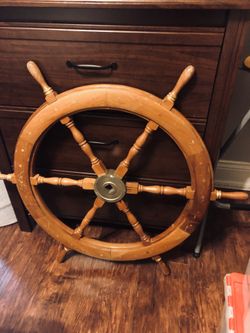 Wooden boat wheel..