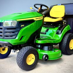 Brand new John Deere S110 42-in 19 - HP Gas Riding lawn mower comes with John Deere Bagger.