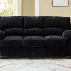 Ashley Home Furniture Black Corduroy Couch. Like new. The cushions come out for easy cleaning. Very comfy & soft couch.   Paid $600+ 6 mos ago.   Dime