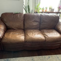 Leather Couch And Chair.  Glass Coffee Table