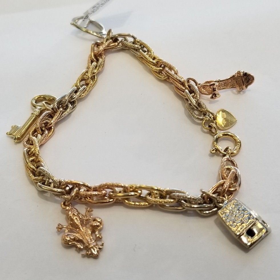 18k whote,rose and yellow gold bracelet with charms