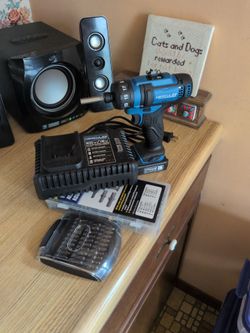 Drill, bits, battery and charger with wood screw and anchor kit