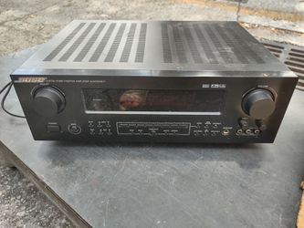 used Insignia IS-HC040917 6.1-channel digital home theater receiver, featuring a prominent volume knob and multiple input