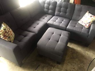 Blue-Grey Sectional with Ottoman and Accent Pillows