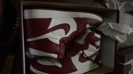 US 10.5 Nike Air Jordan 1 Retro High OG sneakers feature a classic white and team red colorway