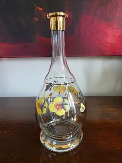 Hand-painted crystal decanter with yellow floral design, Romanian origin