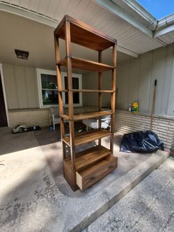 Bernhardt shelving unit with drawer. Solid brass accents.