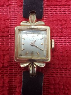 18K GOLD OMEGA WOMENS WATCH 